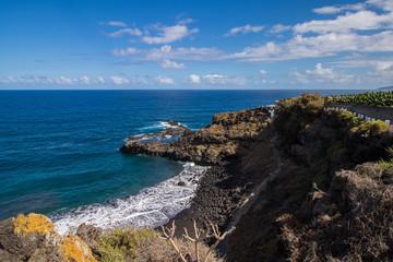Panoramic view of Bollullo Beach a black vulcanic sand beach in Tenerife, Canary Island, Spain