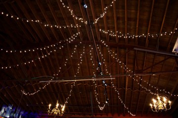 ndoor Christmas lights strung up to create lighting decor in restaurant 