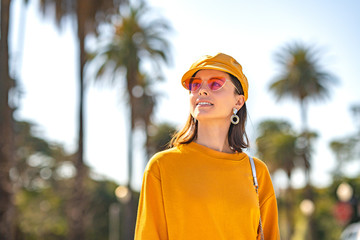 Smiling woman in a yellow sweatshirt