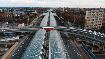 Warsaw, Poland, 03.20.2020. - The anti-noise glass tunnel and overpass Trasa Torunska highway in north-east Warsaw.
