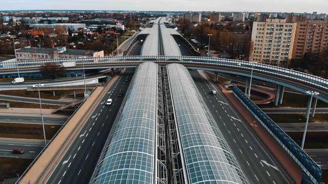 Warsaw, Poland, 03.20.2020. - The anti-noise glass tunnel and overpass Trasa Torunska highway in north-east Warsaw.