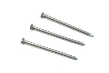 Closeup view of metal nails on a white background