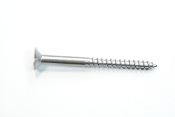 Closeup view of metallic screw on a white background
