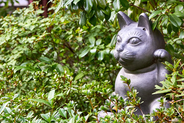 Welcoming cat sculpture in the garden