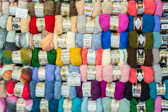 Moscow, Russia - February 14, 2019: Stend of yarn for knitting in a shop. Colorfull textrure background