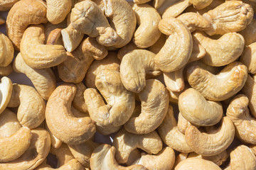 nuts in warm toning, background texture and place for advertising