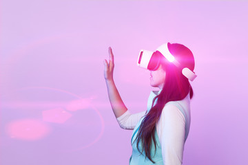 Woman is using virtual reality headset.