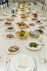 table with food covered with a white tablecloth