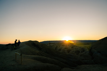 Silhouette of a bicycle in the mountains at sunset