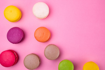 Traditional macaroon macaroon cookies on a pink background