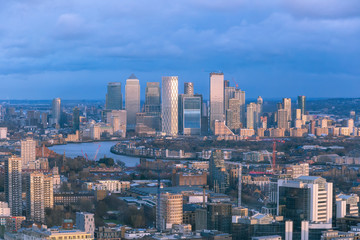 Fototapeta na wymiar Aerial cityscape of London and the River Thames with Canary Wharf in the background