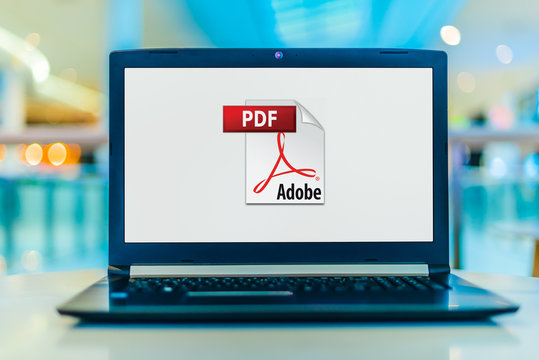 Laptop computer displaying logo of Adobe Acrobat
