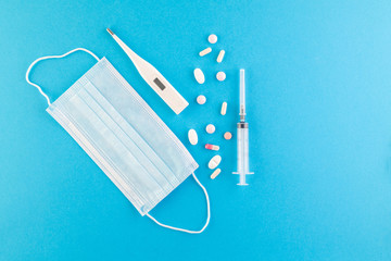 A set of hygienic antiseptics and medications on a blue background.