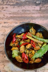 Oseng Kerang Saus Tiram, Indonesian food. Stir-fried mussels with oyster sauce, soy sauce, lemongrass, bayleaf, ginger, garlic and chili.