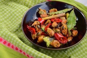Oseng Kerang Saus Tiram, Indonesian food. Stir-fried mussels with oyster sauce, soy sauce, lemongrass, bayleaf, ginger, garlic and chili.