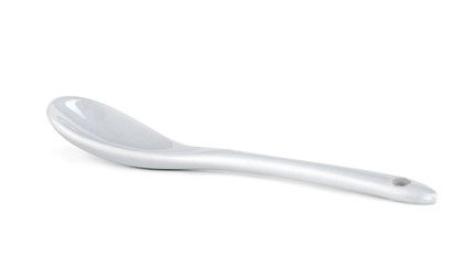 White ceramic spoon isolated on a white background