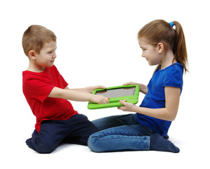 Two kids boy and girl fighting for tablet .