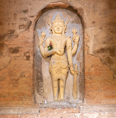 Fototapeta na wymiar Buddha Statue inside old pagoda Bagan