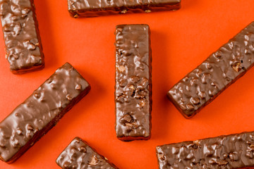 Crispy waffle sticks on a red background