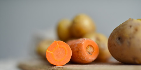 boiled potatoes in the skin and orange carrots