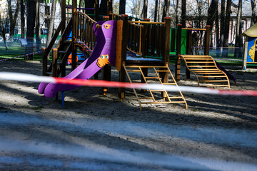 Fototapeta na wymiar children's playground is quarantined due to coronavirus covid-19, Ukraine, Kiev, march 2020
