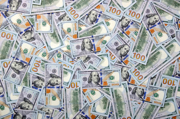  Heap of one hundred dollar bills on money