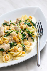 pasta orecchiette with chicken meat, chick peas and spinach