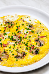 egg omelette with mushrooms and bacon