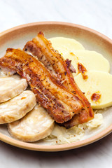 pork meat with two types of dumplings and cabbage