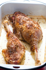 baked goose legs with cumin in frying pan