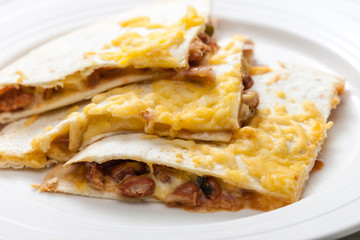 quesadilla filled with beans and chedar cheese