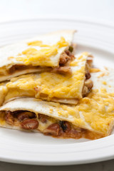 quesadilla filled with beans and chedar cheese