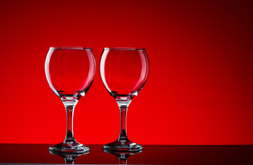 Crystal glasses shot close-up on a red background