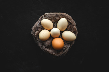 Fresh two color chicken and quail eggs