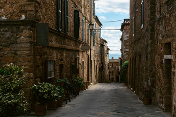 Medieval street in old Italian hill town. Tuscany, Italy