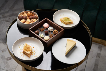  Sweet cookie snack, cake slices and chocolate candy on table, close-up