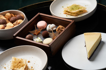  Sweet cookie snack, cake slices and chocolate candy on table, close-up