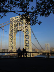 Fort Lee, New Jersey: Silhouettes of visitors to Fort Lee Historic Park overlooking the George...