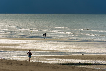 Fototapeta na wymiar sunset and low tide on the beach of Ostend in Belgiu