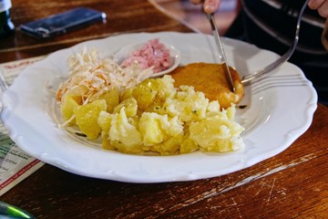 Traditional Slovakish dish Fried Cheese with potatoes and cabbage
