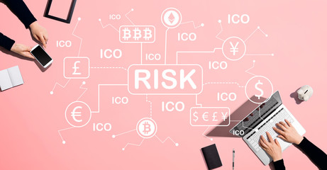 Cryptocurrency ICO risk theme with people working together with laptop and phone