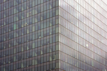 Abstract architecture. Glass blue square Windows of facade modern city business building skyscraper. The texture of the windows of the building.