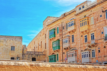Houses with white and green balconies at Valletta