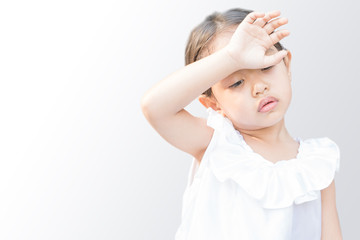 Fototapeta premium The girl is sick and has a headache.