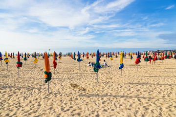 Deauville, France. Beach and multicolored sun umbrellas