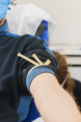 Close up arm of a man preparation for taking blood from a vein, prepare to donate blood, donor day