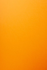Orange color paper background, texture, copy paste, vertical.
