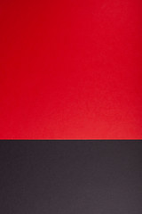 Obraz premium Black and red, paper background color, texture, copy space, vertical.