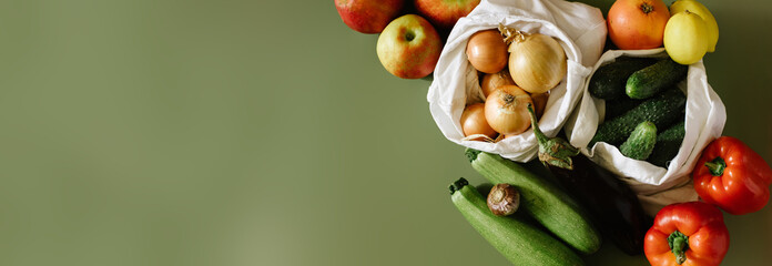 Zero Waste Organic Food In Eco Bag On Green Background. Top View. Reusable Green, Zero Waste,Minimalism, Lifestyle Concept. Place for text