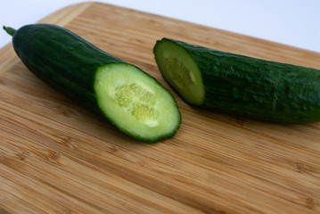 Cucumber sliced on a wooden board